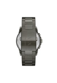 Orologio in metallo grigio con una cassa rettangolare robusta e un bracciale in acciaio inossidabile. Presenta un vetro rotondo trasparente e un logo inciso sul retro.
