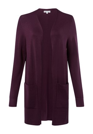 Offene Strickjacke aus tiefviolettem Strickstoff. Verfügt über lange Ärmel und zwei Fronttaschen. Glatte Textur mit gerippten Bündchen.