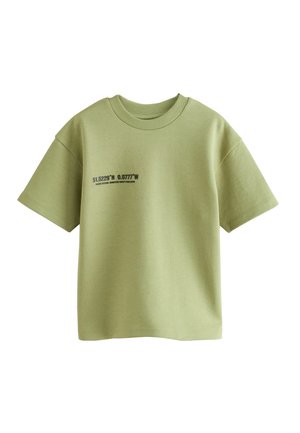 Helles grünes T-Shirt mit kurzen Ärmeln aus glattem Baumwollstoff, das auf der linken Seite ein gedrucktes Koordinatendesign in Schwarz zeigt, mit rundem Ausschnitt.