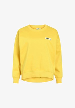 Kollane pika varrukaga ümarkaelusega dressipluus ribiga varrukate ja alumise äärega, vasakul rinnal väike valge silt tekstiga "ROUGE EDIT".