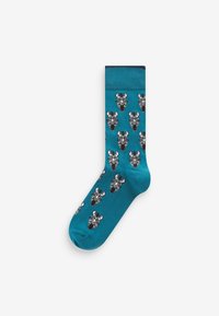 Türkise Socken mit einem wiederholten Muster von schwarzen und weißen Zebra-Köpfen; glatte Textur; gerippter Bund oben für einen guten Sitz.