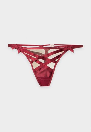 String pour femmes en satin rouge et maille avec bretelles croisées et petits nœuds sur les côtés.