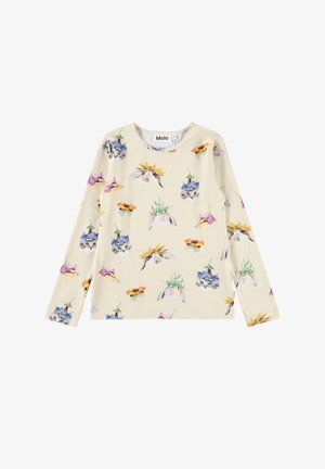 Kremowa koszula z długimi rękawami, z powtarzającymi się wzorami królików, kotków i ptaków noszących kolorowe kwiatowe kapelusze.