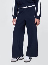 Navy wide-leg sweatpants with elastic waistband, featuring subtle GAP logo. Made of soft fabric, designed for comfort and relaxed fit.