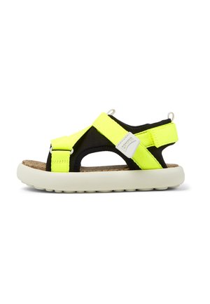 Svart och neongul sandal med justerbara remmar, korkfotbädd och en vit gummisula med texturerad botten för bättre grepp.