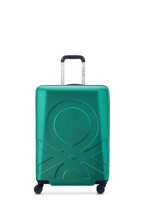 Green hard-shell suitcase with textured geometric pattern, retractable handle, and four wheels for mobility. Durable and lightweight design.
