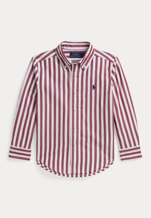 Skjorte med knapper og lange ærmer med lodrette røde og hvide striber samt en blå Polo Ralph Lauren-logo på venstre bryst.