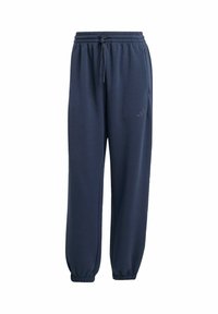 Marineblauwe joggingsbroek van zacht materiaal, met een elastische tailleband met trekkoord, elastische manchetten en twee zijzakken.