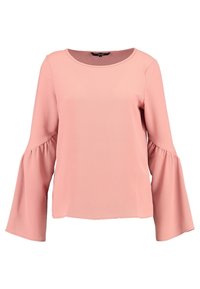 Blouse rose pâle à manches longues avec un col rond, dotée de poignets évasés et d'un tissu texturé. Design simple et décontracté.