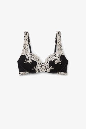 Zwarte bh met ingewikkelde crèmekleurige bloemmotieven, gevoerde cups en verstelbare straps. Getextureerde stof, gladde afwerking en delicate accenten.