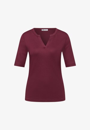 Naisten lyhythihainen viininpunainen paita, jossa on V-muotoinen pyöreä pääntie, istuva siluetti ja sileä kangaspinta.