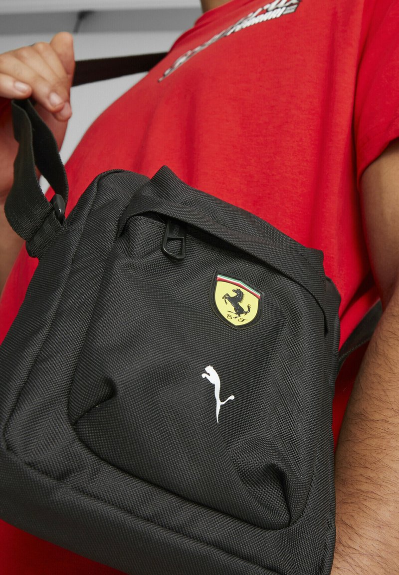 Puma SCUDERIA FERRARI SPTWR RACE Geantă crossbody black/negru Zalando.ro