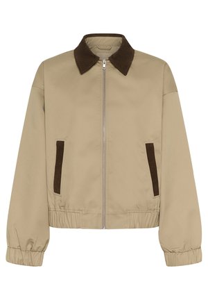 Bež jakna s ovratnikom od smeđeg manšestra, patentnim zatvaračem sprijeda i elastičnim strukom. Ima dva smeđa manšestrena bočna džepa.