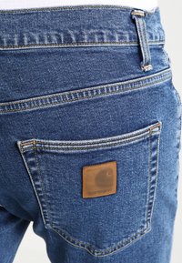 Carhartt WIP KLONDIKE MILLS - Tiesaus kirpimo džinsai - blue stone washed