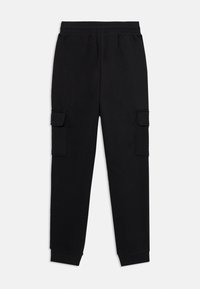 Pantalons de jogging noirs avec une coupe décontractée, une taille élastique et deux poches cargo sur les côtés. Fabriqués en tissu doux et texturé.