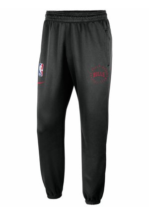 Schwarze sportliche Jogginghosen mit elastischem Bund, mit rotem "Bulls"-Logo und NBA-Emblem. Enthält Seitentaschen und tapered Cuffs.