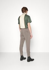 DRYKORN Kalhoty - beige