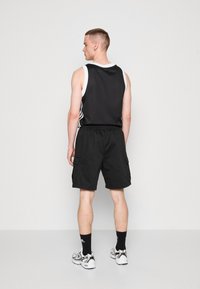 adidas Originals CARGO - Teplákové kalhoty - black