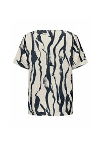 Short-sleeve top in cream with abstract navy stripes, featuring a relaxed fit and textured fabric for added depth.