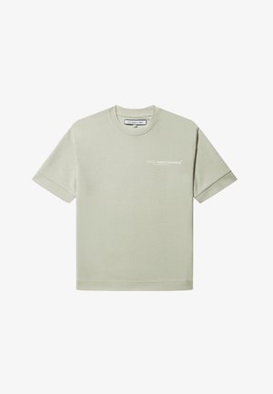 Lys grønn T-skjorte laget av bomull med korte ermer, rund hals, og en liten hvit logo trykket på venstre foran.