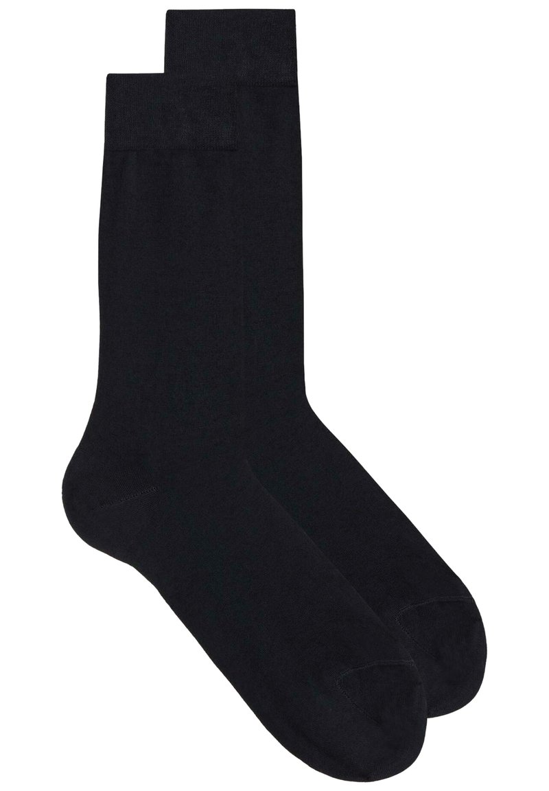 Sorte sokker lavet af et glat, strækbart stof med et klassisk design. Har forstærket tå og hæl samt ribbede manchetter øverst.