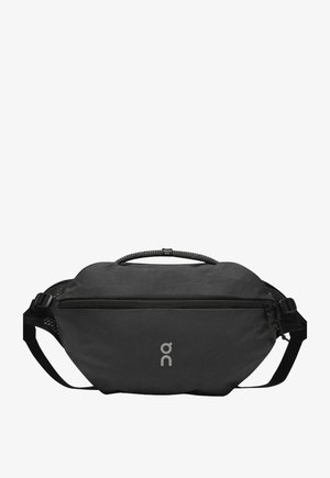 Borsa a vita compatta nera con tasca frontale con zip, cinturino regolabile e manico in corda etichettato "Swiss Seil."