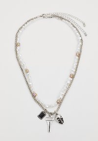 Silver chain necklace with layered design, featuring pearl beads, a black charm, a key pendant, and a skull detail.