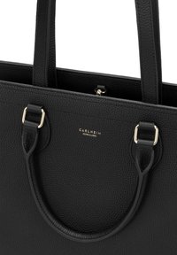 Black leather tote bag with a textured finish, dual top handles, gold-tone hardware, and a subtle embossed logo on the front.