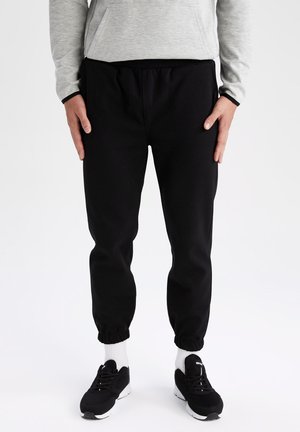 STANDART FIT - Tracksuit bottoms - black