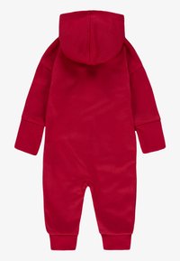 Nike Sportswear COVERALL UNISEX - Overal - gym red