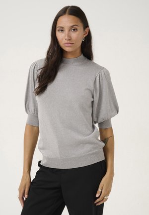 Light gray knit sweater with a high neck, short puff sleeves, and textured finish, paired with black pants. Simple and modern design.