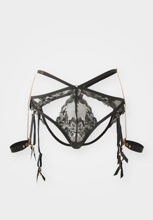 Must mustrõngiga must pitsist alussärk, millel on avatud muster, keerukad lillemustrid ning reguleeritavad rihmad koos kuldsete detailide ja ribade aktsentidega.