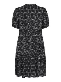 Musta lyhythihainen mekko, jossa valkoisia pallokuvioita, kerroksellinen helma ja istuva vyötärö, nähtynä takaa.