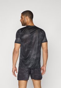 New Balance ATHLETICS PRINTED - T-skjorte til trening - castlerock
