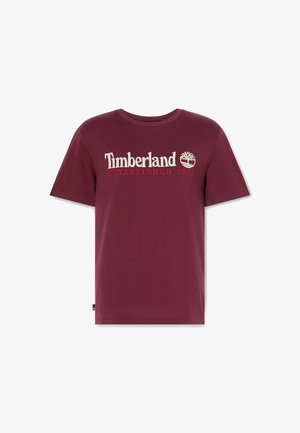 Bordeaux katoenen T-shirt met ronde hals, voorzien van het witte en rode "Timberland" logo en de tekst "ESTABLISHED 1973". Korte mouwen, effen kleur.