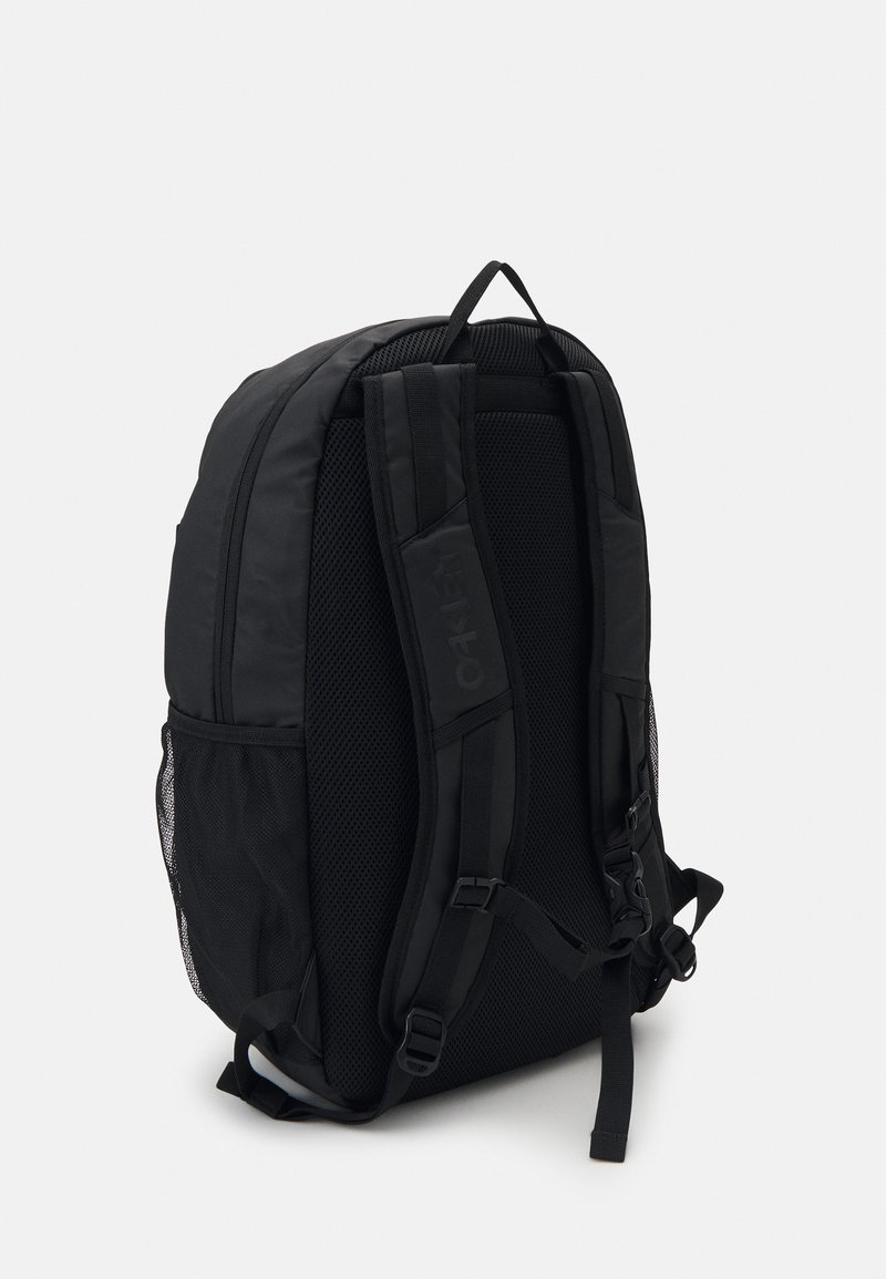 Black backpack made of durable fabric, featuring padded straps, mesh side pockets, and a structured, slightly curved design.