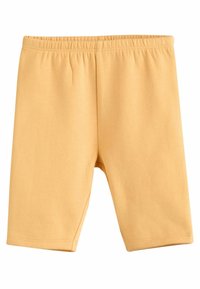 Gula bomullsshorts med elastisk midja, som har en mjuk textur och en längd under knäet. Enkelt och enfärgat design.