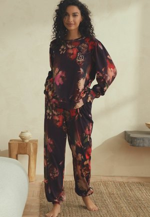 Bloemenpatroon loungekleding set in verschillende tinten donkerpaars, met lange mouwen, elastische boorden en losse broek met een koordsluiting.
