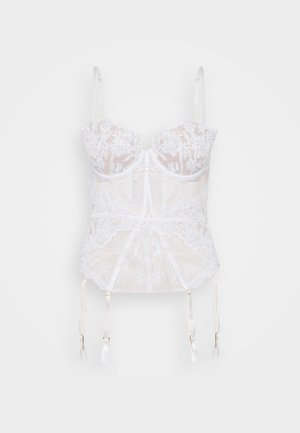 Corset en dentelle blanche avec broderie florale, tissu transparent, bretelles ajustables et attaches de jarretelles en bas. Accents délicats en satin.