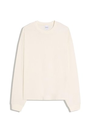 Felpa a maniche lunghe color crema con scollo rotondo, polsini a coste e orlo leggermente corto. Realizzata in morbido cotone.