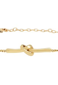 Pulsera de cadena de oro con un detalle de nudo curvado y liso en el centro, y un cierre de cadena ajustable.