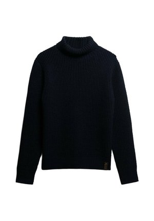 Suéter de cuello alto de punto en azul marino oscuro con un patrón texturizado, mangas largas y puños y dobladillo de canalé. Presenta una pequeña etiqueta de logo.