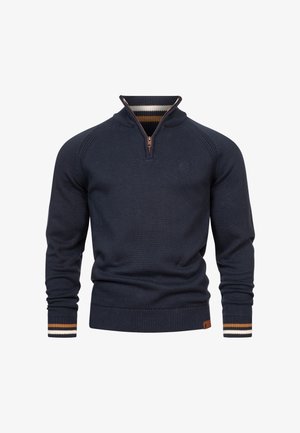 Marineblauwe zip-neck sweater met geribbelde manchetten en zoom, voorzien van een gestreept patroon in oranje, wit en bruin op de manchetten.