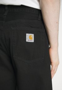 Carhartt WIP LANDON PANT - Jeans relaxed fit - black