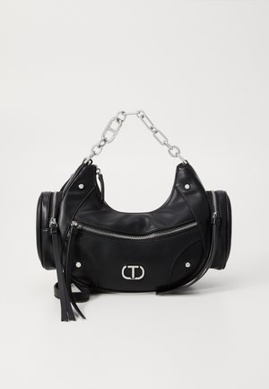 Black leather handbag featuring a round shape, silver chain strap, multiple zippered pockets, and prominent logo detail on the front.