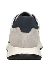 Gray suede sneaker viewed from the back with a white sole and black heel tab.