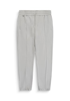 Pantaloni da jogging grigio chiaro con vita elastica, coulisse, tasche laterali e polsini elastici.