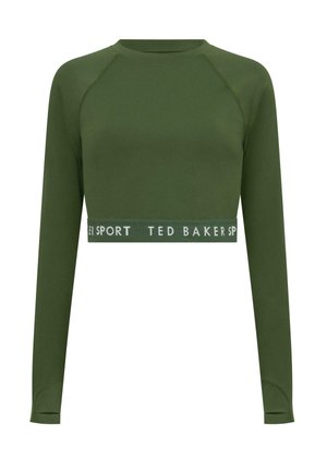 Zelený dlouhý rukáv cropped top vyrobený z hladkého materiálu. Má raglánové rukávy a široký pas s bílým textem "TED BAKER SPORT".