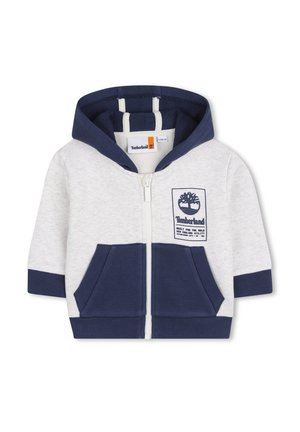 Zippered hoodie in gray and navy. Made of soft cotton, featuring front pockets, a blue-lined hood, and a Timberland logo patch.