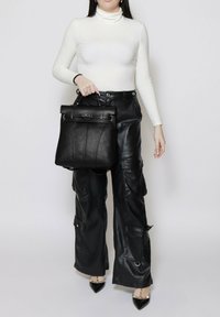 Roberta Rossi CONVERTIBLE INTO - Rugzak - black